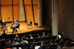 During an open reading session for student compositions, cellist and Playground Ensemble member Richard vonFoerster gives feedback to the composer.