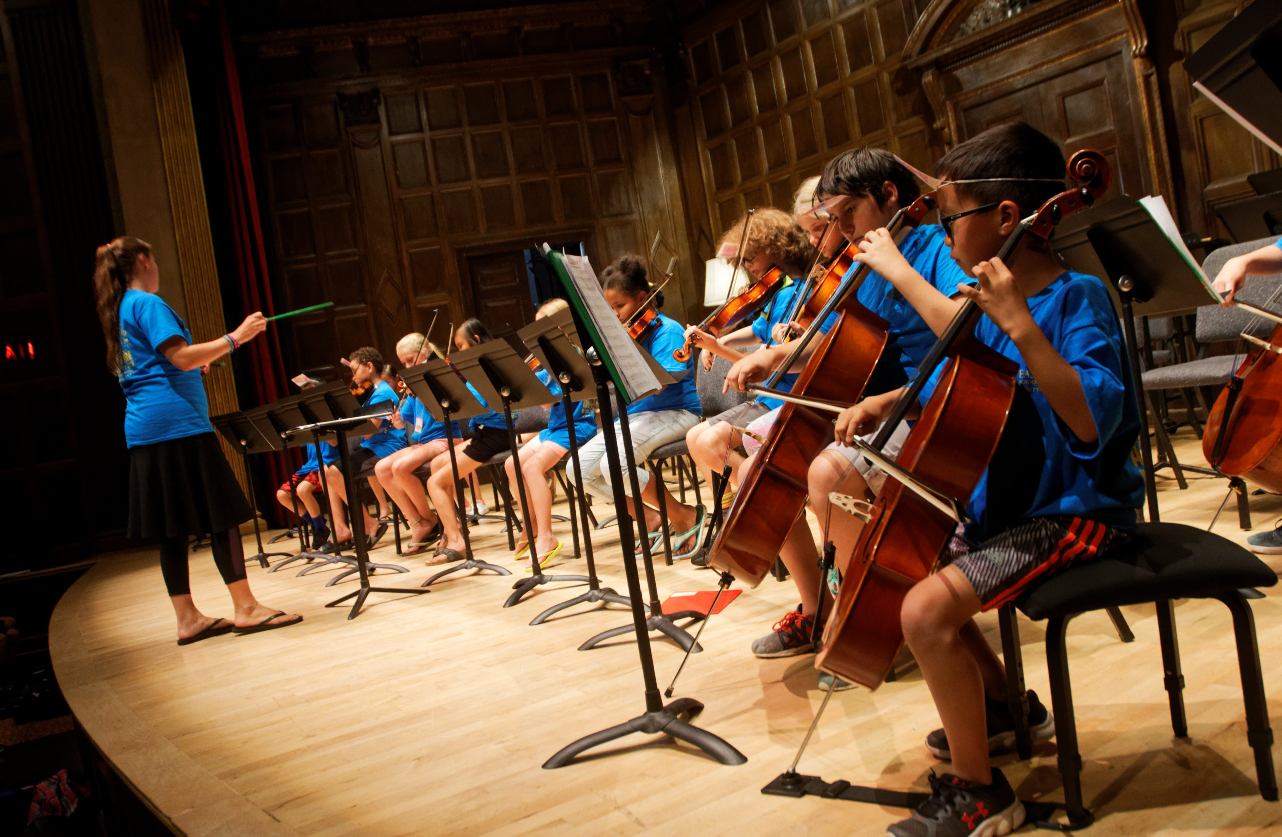 Students playing on stage during ECMS Adventure Music Camp