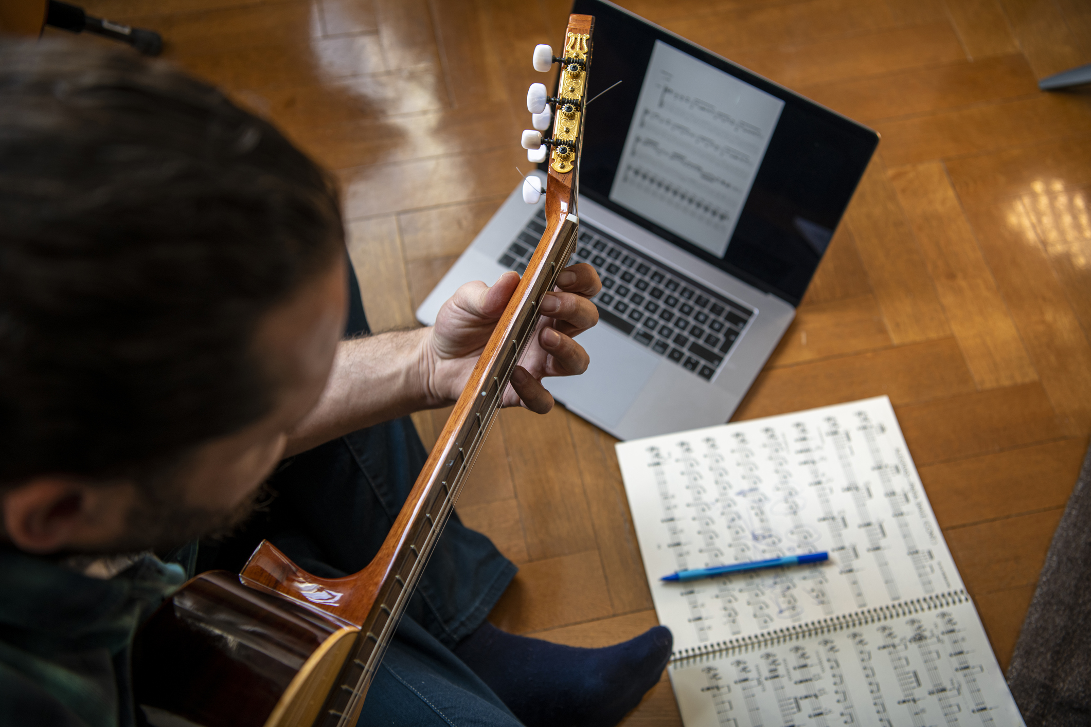 Guitarist composing at home