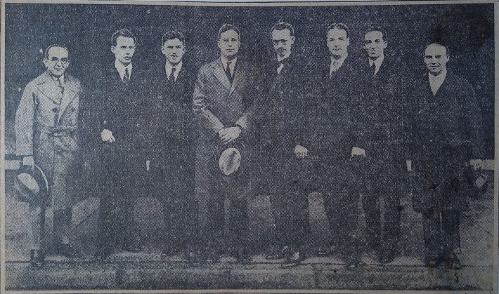 Photograph printed in the Rochester Democrat & Chronicle of seven composers posing on Gibbs Street with Howard Hanson.