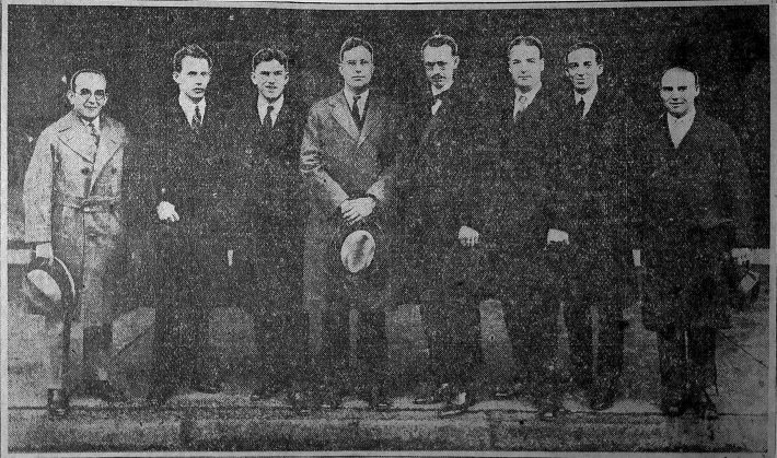 Photograph printed in the Rochester Democrat & Chronicle of seven composers posing on Gibbs Street with Howard Hanson. From left to right, they are