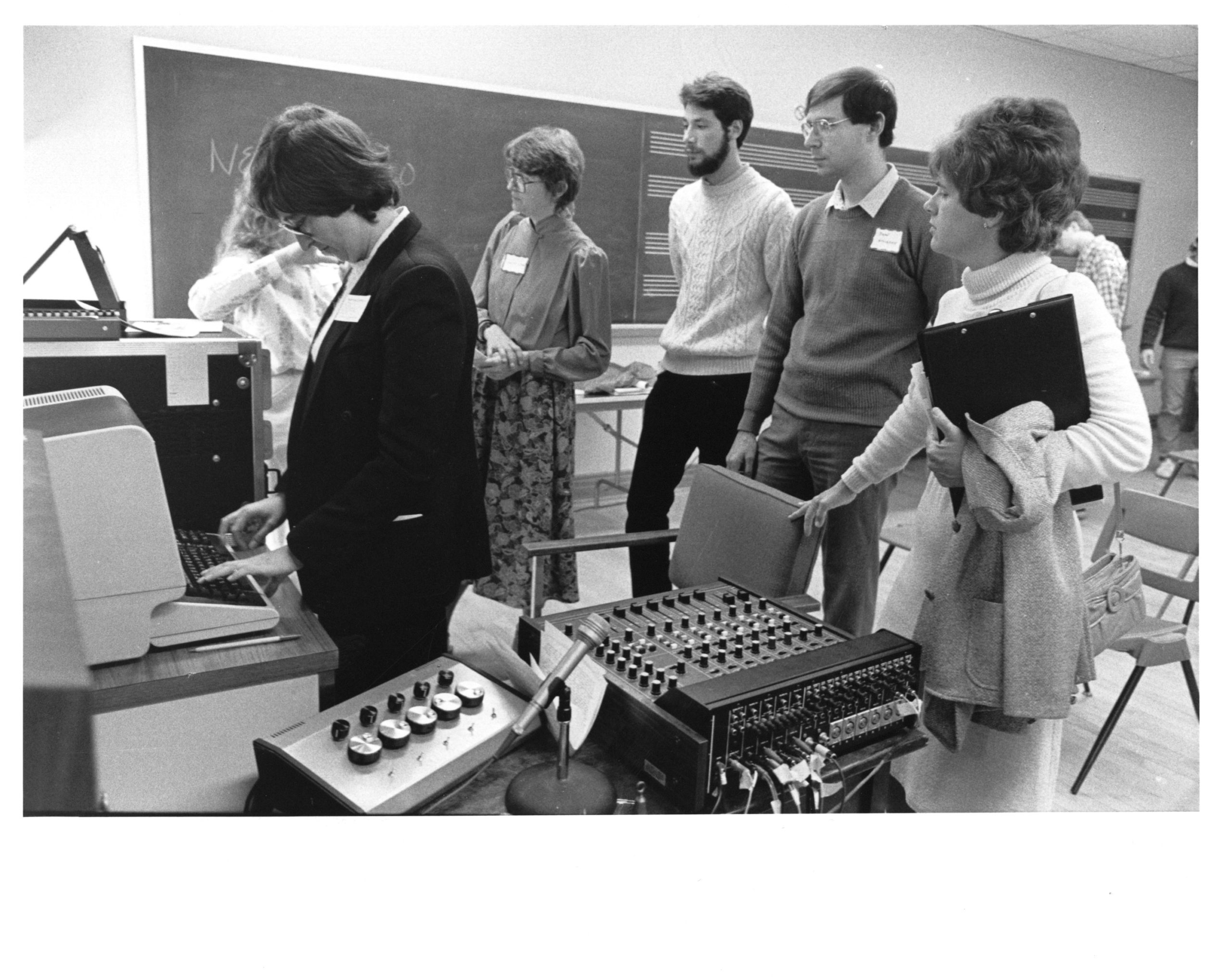 photo of group viewing ECMC equipment