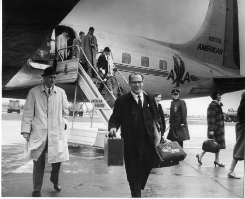 Mr. Robert Sattler, Eastman School [Concert Bureau Director] who accompanied the Eastman Philharmonia on tour, is here seen on arrival at Idlewild Airport where the Philharmonia members would rest and receive briefings before boarding their chartered plane for Europe. Photo by Louis Ouzer.