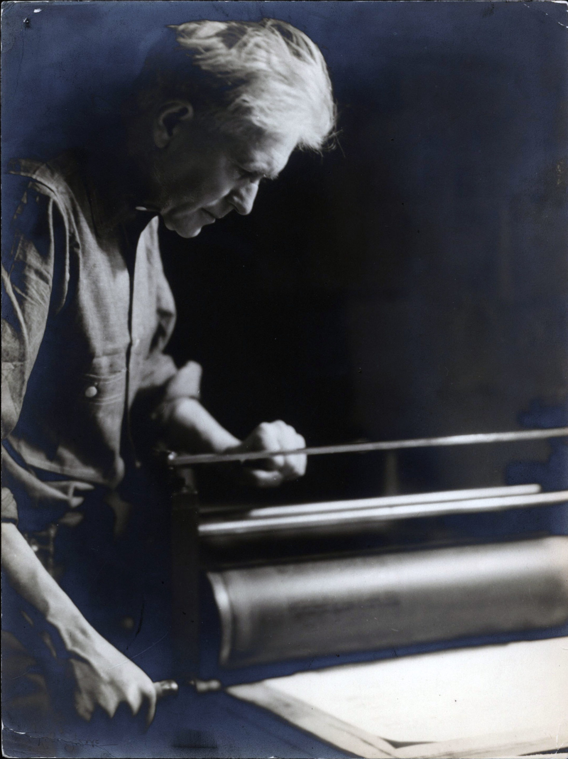 Farwell working at his lithograph press (1938).