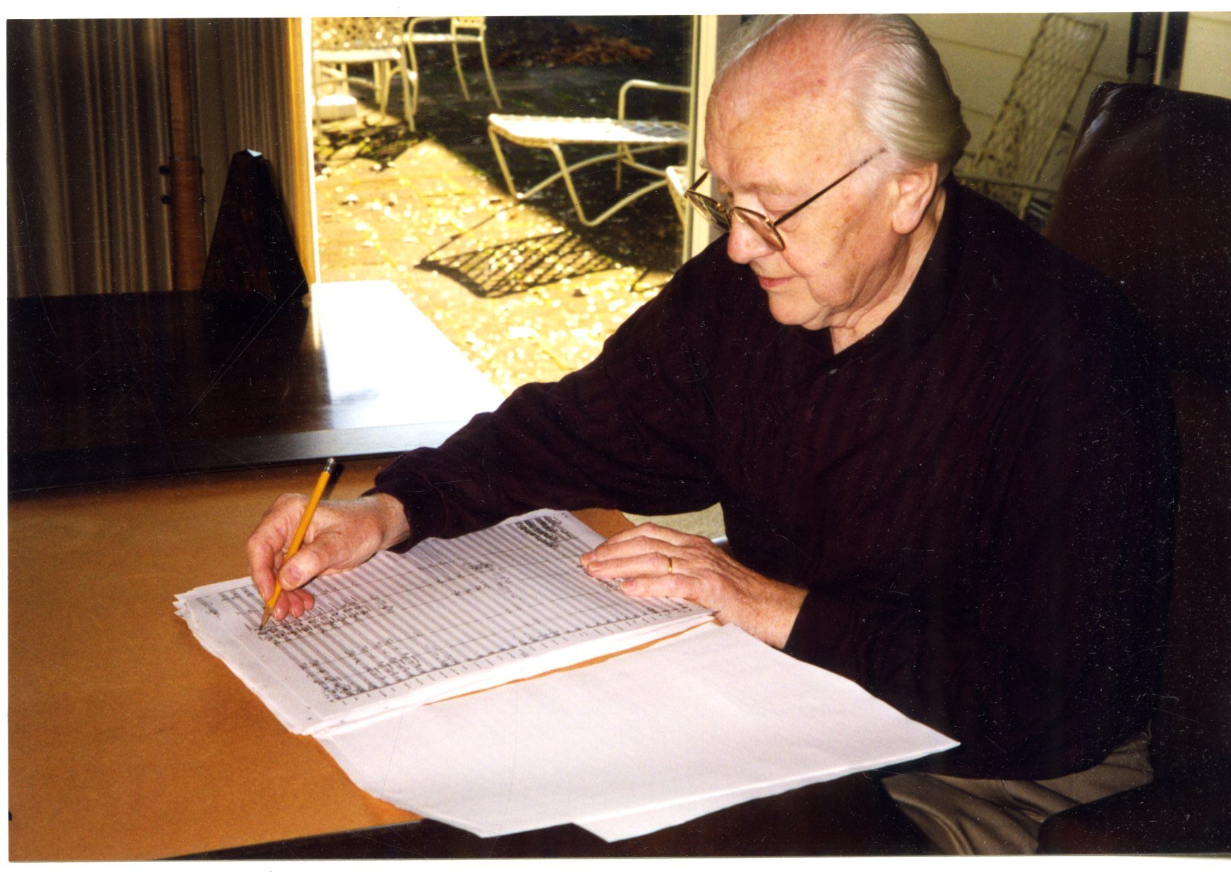 Karel Husa, composing at home.