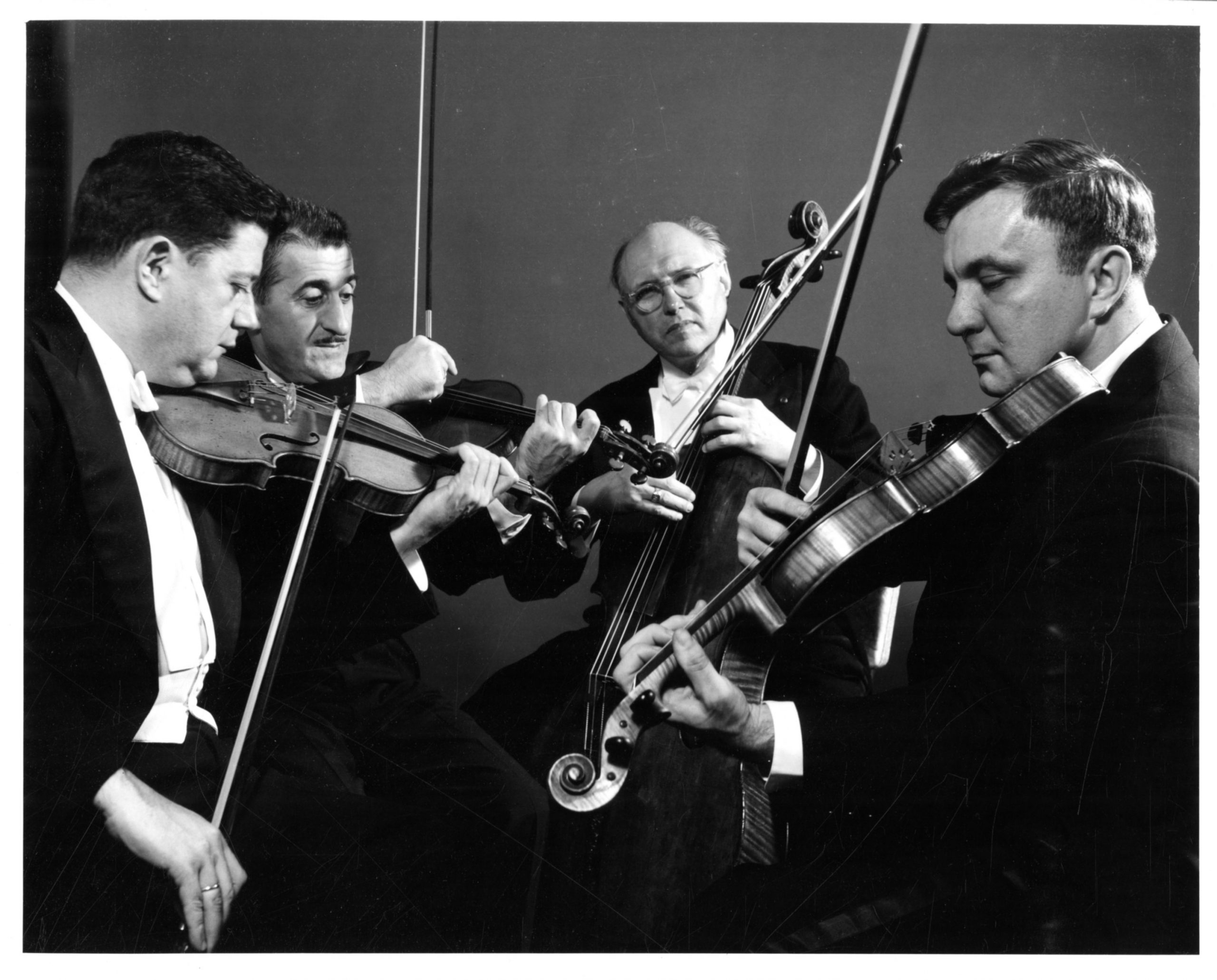 Publicity photo of the Eastman String Quartet. From left to right, first violinist Joseph Knitzer, second violinist John Celentano, violoncellist Georges Miquelle, violist Francis Bundra. John Celentano Collection, Sibley Music Library.