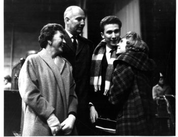 Joyous reunions taking place inside the airport terminal as family members and friends greet the returning members of the Eastman Philharmonia. Eastman School Photo Archive