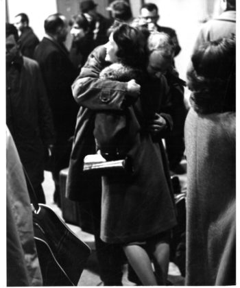 Joyous reunions taking place inside the airport terminal as family members and friends greet the returning members of the Eastman Philharmonia.