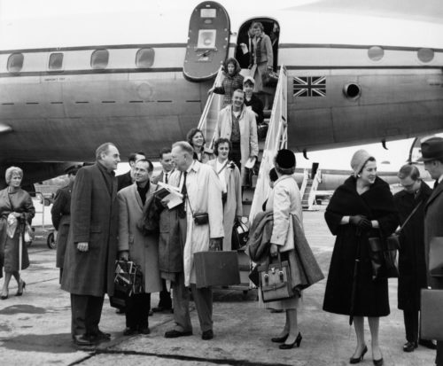 ESPA 8x10 6-38 Members of the Eastman Philharmonia, accompanied by their two conductors and chaperones, are here seen alighting from their jet on arrival at Lisbon.