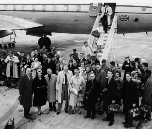 Members of the Eastman Philharmonia, accompanied by their two conductors and chaperones, are here seen alighting from their jet on arrival at Lisbon.