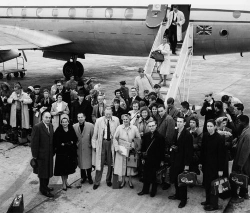 ESPA 8x10 6-56 Members of the Eastman Philharmonia, accompanied by their two conductors and chaperones, are here seen alighting from their jet on arrival at Lisbon.