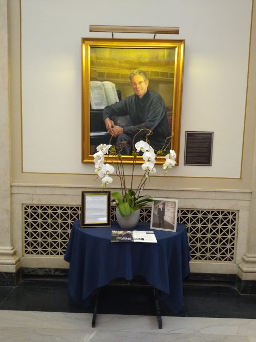 Memorial table under Dean Douglas Lowry portrait in Lowry Hall.