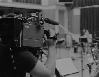 A cameraman for local television news captures footage of the Eastman Jazz Ensemble’s recording session on February 27th, 1983. Louis Ouzer Archive