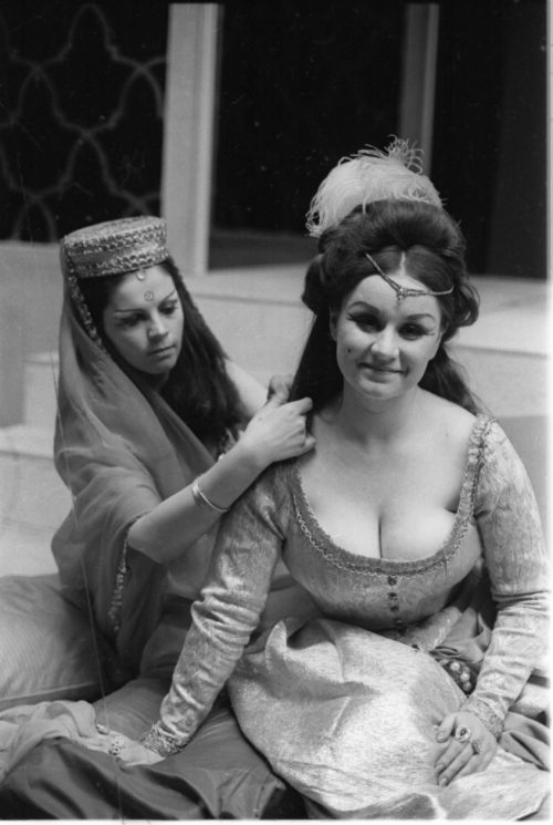 R1167-14 Members of the cast in repose during dress rehearsal.