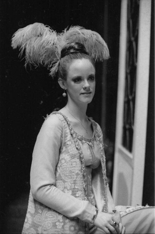 R1167-16 Members of the cast in repose during dress rehearsal.