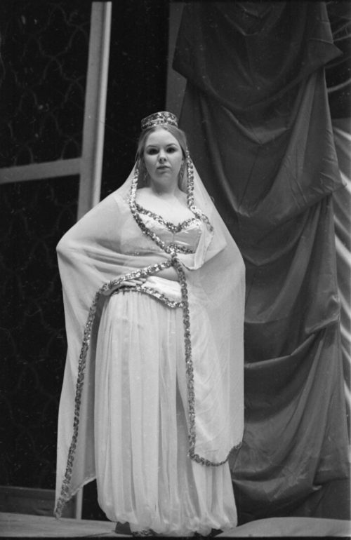 R1167-18 Members of the cast in repose during dress rehearsal.