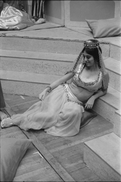 R1167-9 Members of the cast in repose during dress rehearsal.