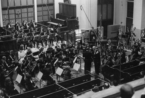 R1307-11A With the members of the Eastman Philharmonia in place, conductor Walter Hendl, organist David Craighead, and composer Samuel Adler acknowledge the applause after the performance of the Concerto for Organ and Orchestra.