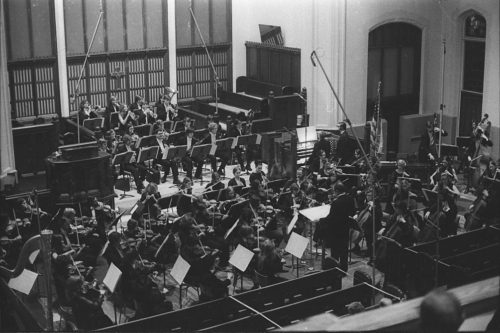 R1307-17A With the members of the Eastman Philharmonia in place, conductor Walter Hendl, organist David Craighead, and composer Samuel Adler acknowledge the applause after the performance of the Concerto for Organ and Orchestra.