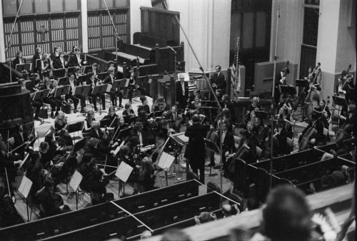 R1307-7A With the members of the Eastman Philharmonia in place, conductor Walter Hendl, organist David Craighead, and composer Samuel Adler acknowledge the applause after the performance of the Concerto for Organ and Orchestra.