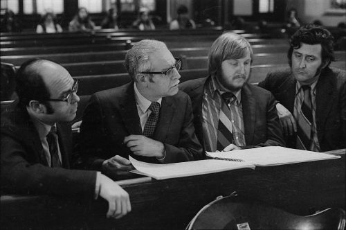 During a rehearsal in Lake Avenue Baptist Church, Eastman School composers Samuel Adler, Wayne Barlow, and Joseph Schwantner peruse the score of the Concerto for Organ and Orchestra, joined (at right) by local music critic Ted Price.