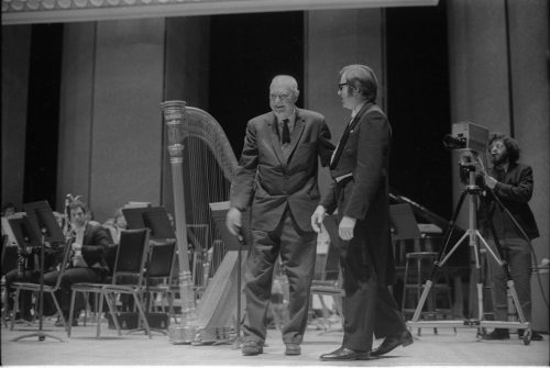 Howard Hanson greets Donald Hunsberger and acknowledges the audience’s applause on the occasion of the Eastman Wind Ensemble’s premiere performance of his Dies Natalis II, April 7th, 1972.
