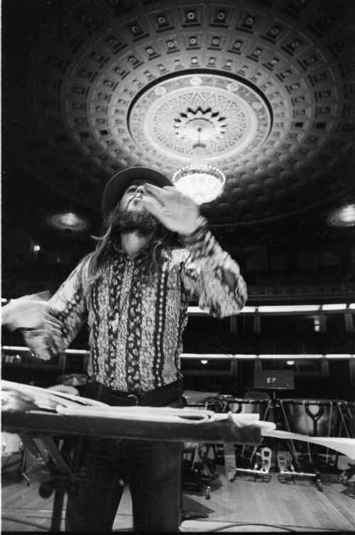 Chuck Mangione on the podium in the Eastman Theater, captured by Louis Ouzer during a rehearsal. This striking sequence is emblematic of Mr. Ouzer’s penchant of capturing conductors on the podium with the visually imposing chandelier in the background.