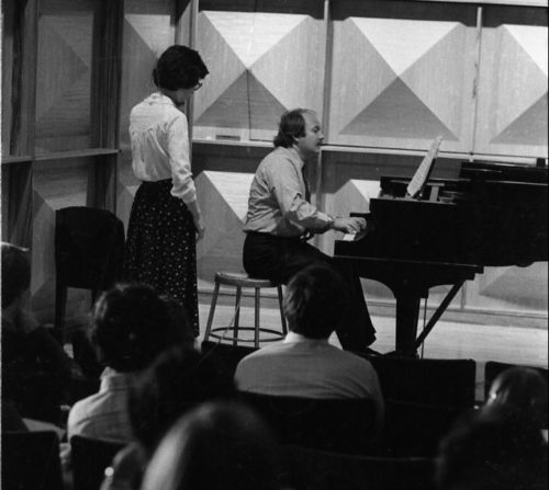 John Perry demonstrating a passage at the keyboard in Howard Hanson Hall.