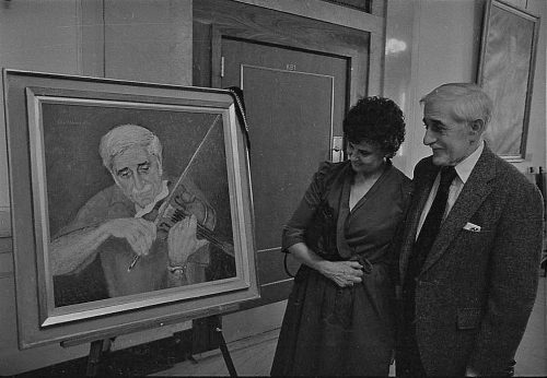 Professor and Mrs. Celentano react to the portrait by John Menihan.