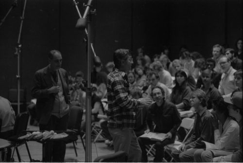 Conductor Donald Neuen addresses the members of the Eastman Chorale while Professor Alfred Mann looks on. Photo by Louis Ouzer, master negative no. R3249-9A.