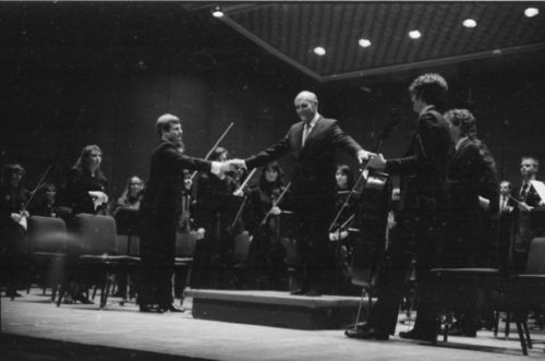 Maestro Georg Solti with the Eastman Philharmonia, acknowledging applause after their performance of Beethoven’s Symphony no. 5 on April 7th, 1987.