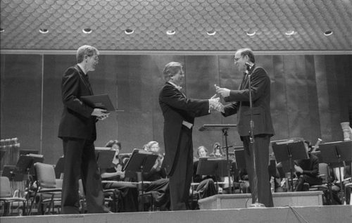 Dr. Donald Hunsberger, conductor of the Eastman Wind Ensemble since 1964, is presented with the National Band Association Academy of Wind and Percussive Arts Society Award by Edward Lisk, President of the NBA.