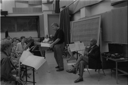 In rehearsal in Room 120 (today the Ray Wright Room), Director Fred Sturm leads members of the Eastman Jazz Ensemble, and confers with guest artist Benny Carter. Photos by Louis Ouzer.