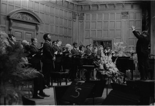 Members of the Eastman Chorale on-stage in Kilbourn Hall, conducted by Professor Milford Fargo. In the first two shots, baritone Joseph Bias (not holding a score) is the soloist.