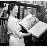 Ruth T. Watanabe, the second director of Sibley Music Library, displays a first edition printing of Handel’s Messiah (1767).