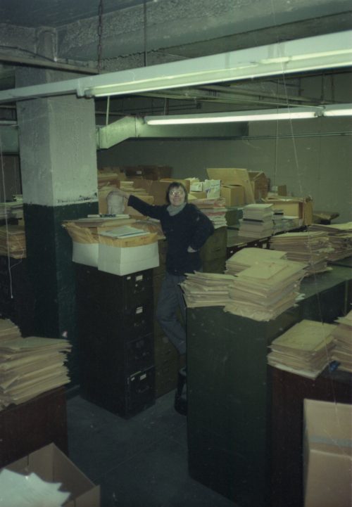 Head Librarian Mary Wallace Davidson of the Sibley Music Library poses among filing cabinets in the 6th-floor archive room at the Cooper Square building of publisher Carl Fischer, LLC.