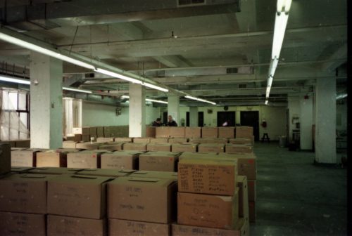 image 18 team members Brodsky, Coppen and Quinn are seen among the lines of shipping crates