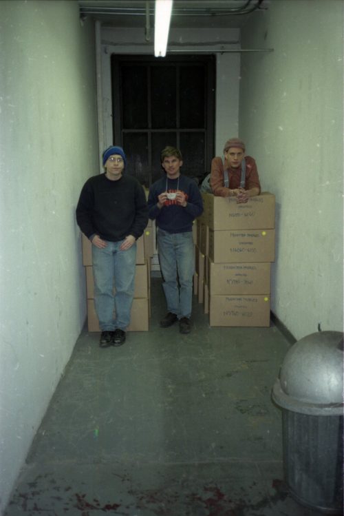 On the first day of work, the active trio — Seth Brodsky, David Peter Coppen, and Ian Quinn pause to pose next to the shipping crates already sealed.
