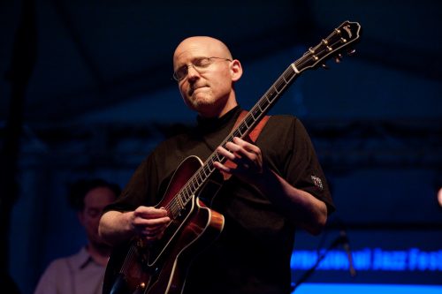 University of Rochester graduate and Eastman School of Music Assistant Professor of Jazz Studies and Contemporary Media Bob Sneider (BA '93) performs songs by legendary jazz guitarist Wes Montgomery during the Rochester International Jazz Festival June 10, 2011. Accompanying Sneider are Paul Hofmann on piano, Phil Flanigan on bass and Mike Melito on drums. //photo: J. Adam Fenster/University of Rochester