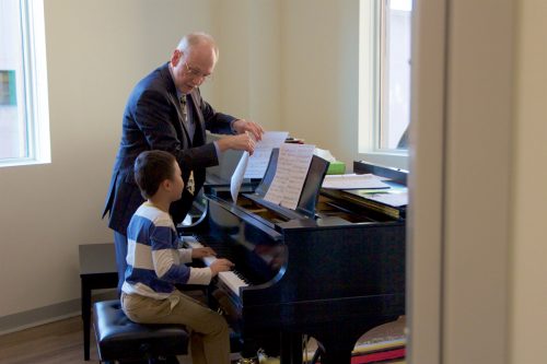 Professor Howard Spindler teaches a young student