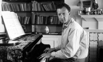 Benjamin Britten sitting at his piano, in 1950.