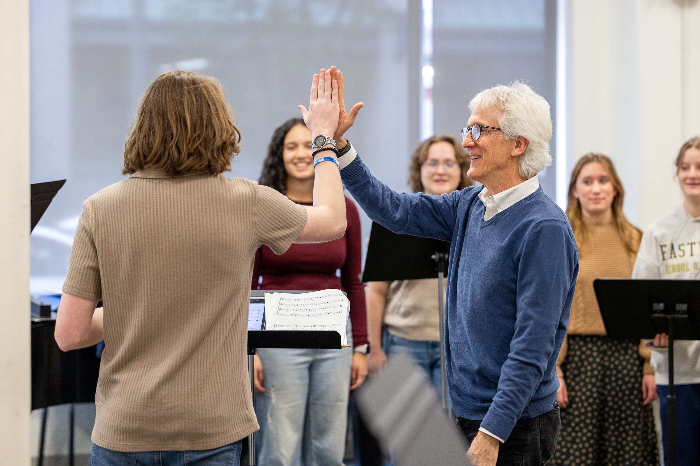 Chris Azzara and student high-five image