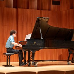 composition student performing his own creation