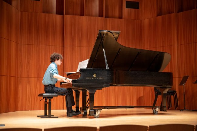 composition student performing his own creation