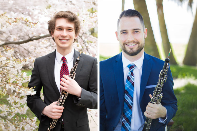 The frame of the image is split between two photos. The left side is a photo of Peter Davies standing infant of blooming cherry blossoms holding an oboe, the right side is John Upton, also holding an oboe standing in a grassy area that appears to be just off of a beach with palm trees which are blurred in the background