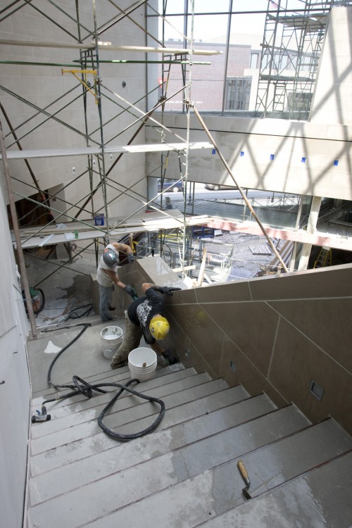Work on the stairs from the mezzanine level bridge to the third floor of the new building