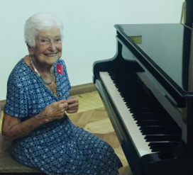 Gloria Mikilaian '45E, an Armenian pianist, playing piano at an art museum in Yerevan, Armenia. 