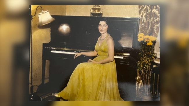 Gloria in Yellow Dress-resize Alumna Gloria Mikialian '45E in a yellow dress at the piano. Date unknown.