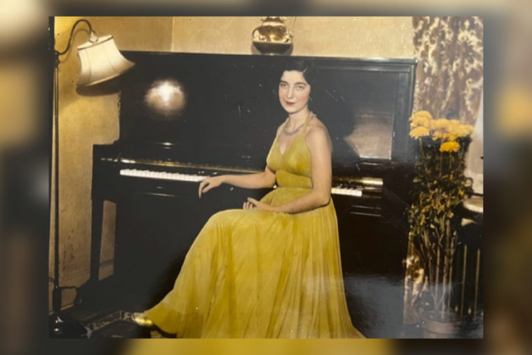 Alumna Gloria Mikialian '45E in a yellow dress at the piano. Date unknown.