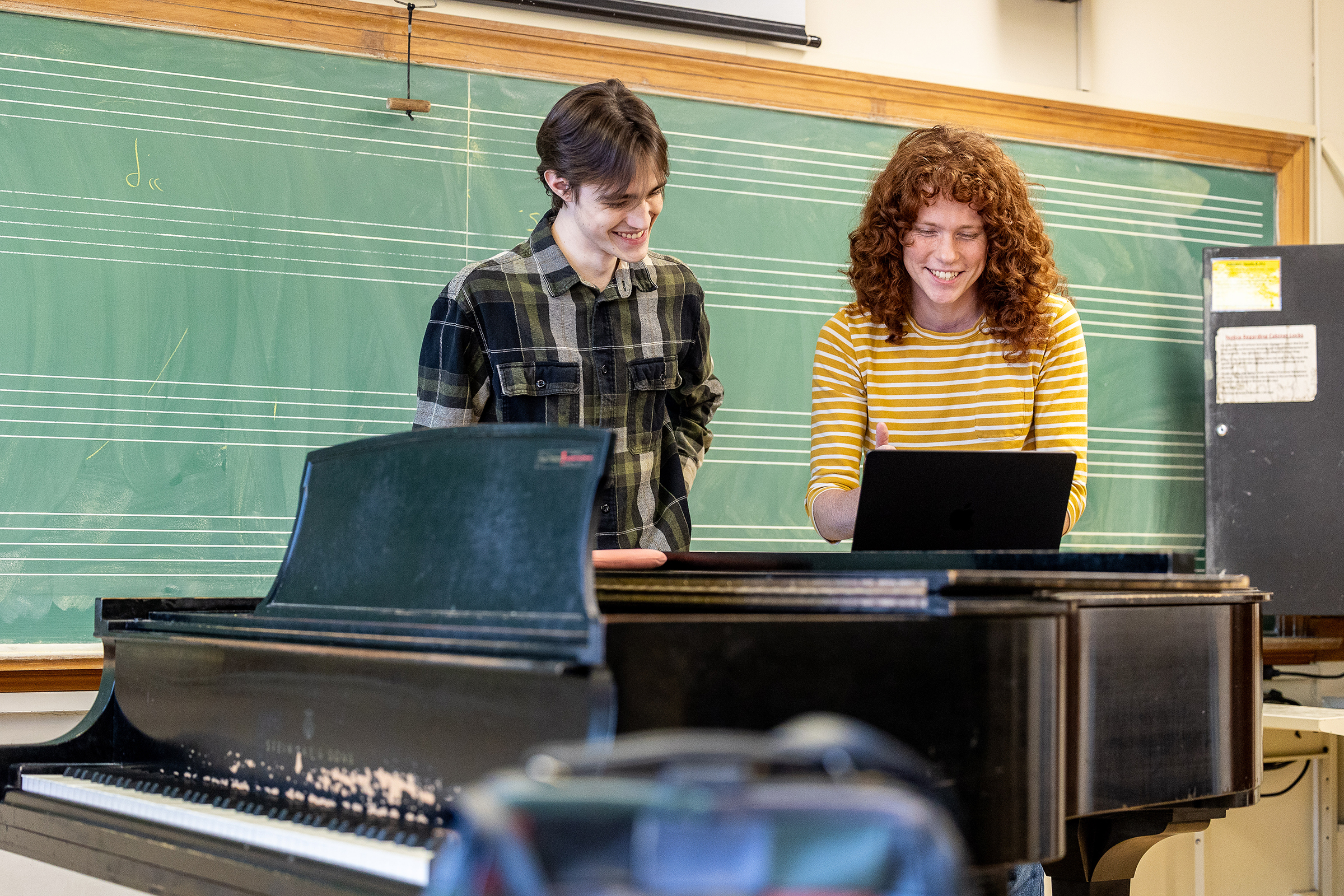 Humanities students at laptop in classroom image